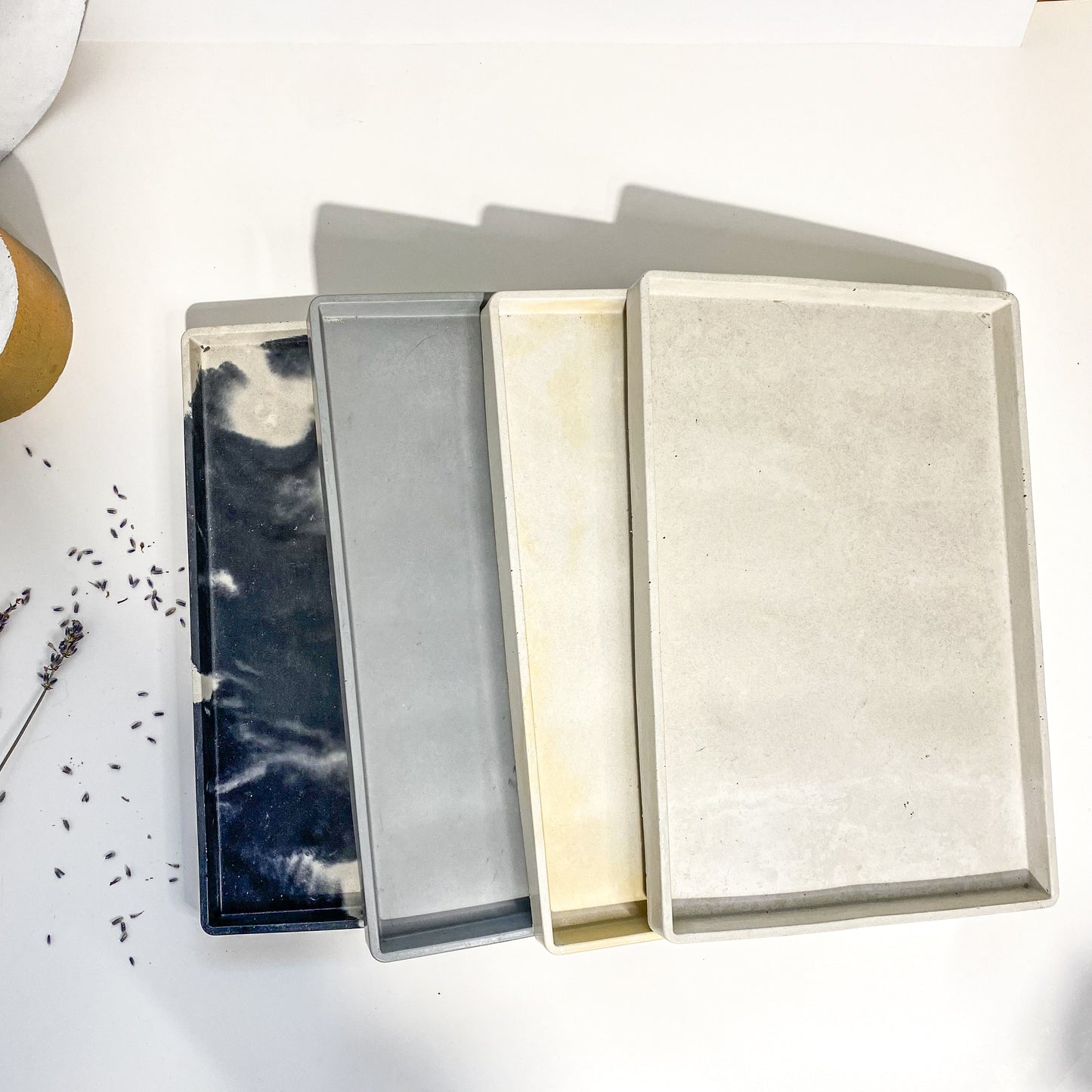 Round and rectangular concrete tray