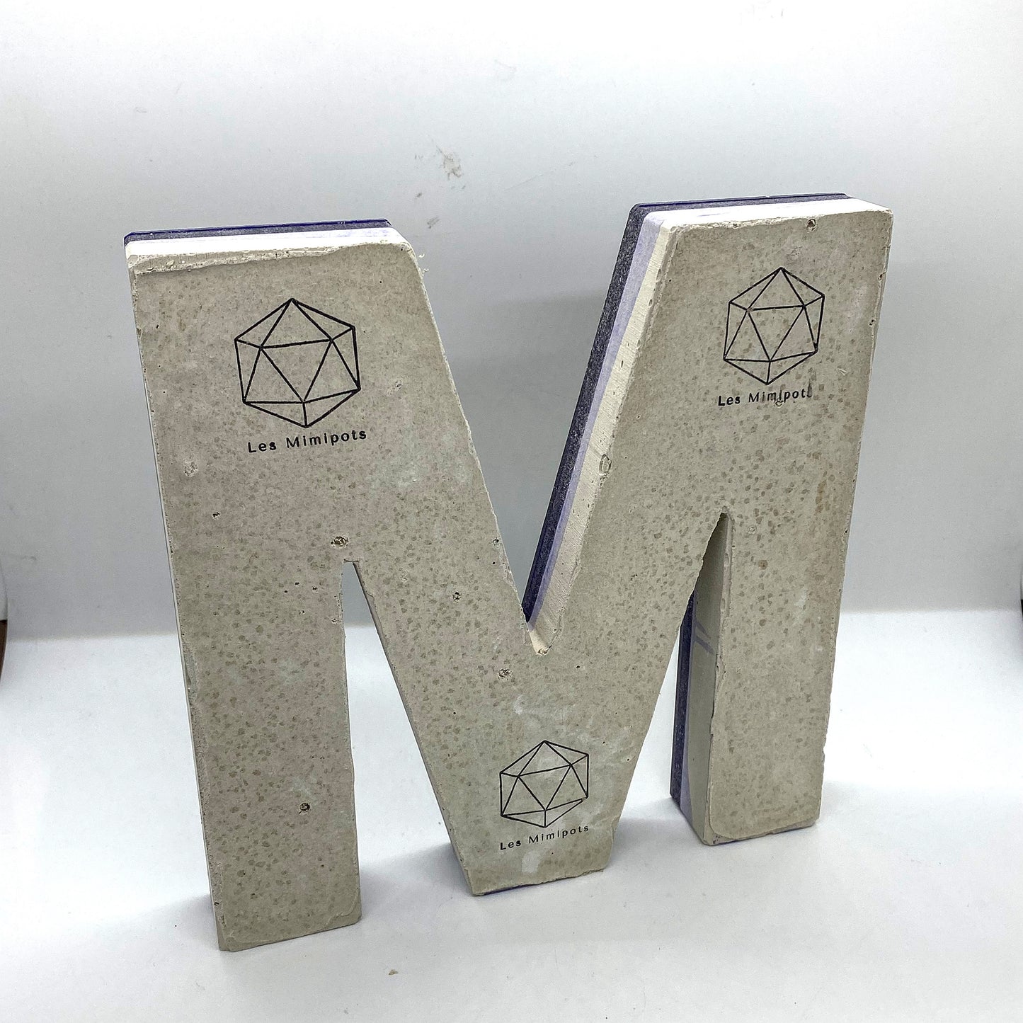 Epoxy-concrete letter M