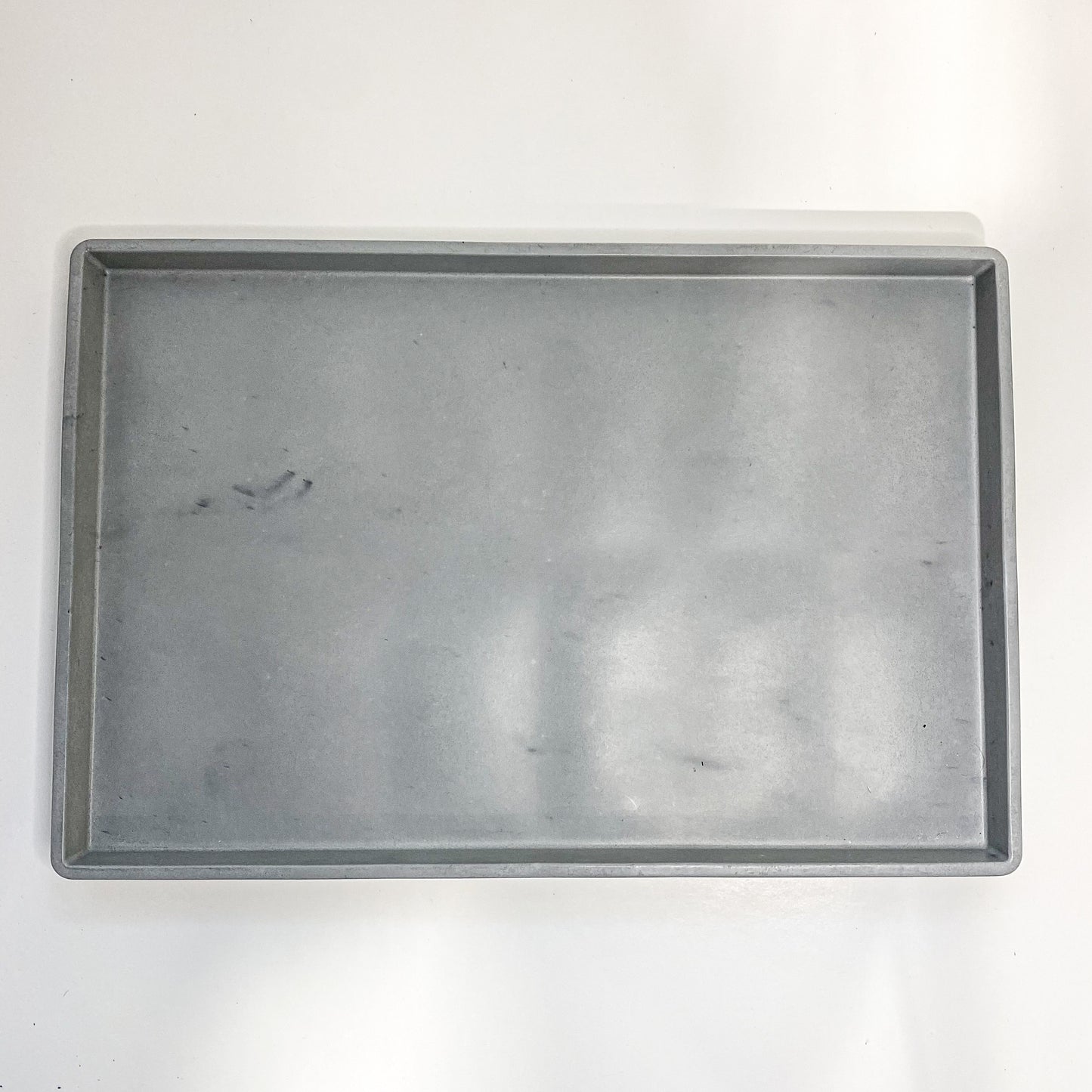 Round and rectangular concrete tray