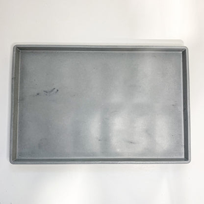 Round and rectangular concrete tray